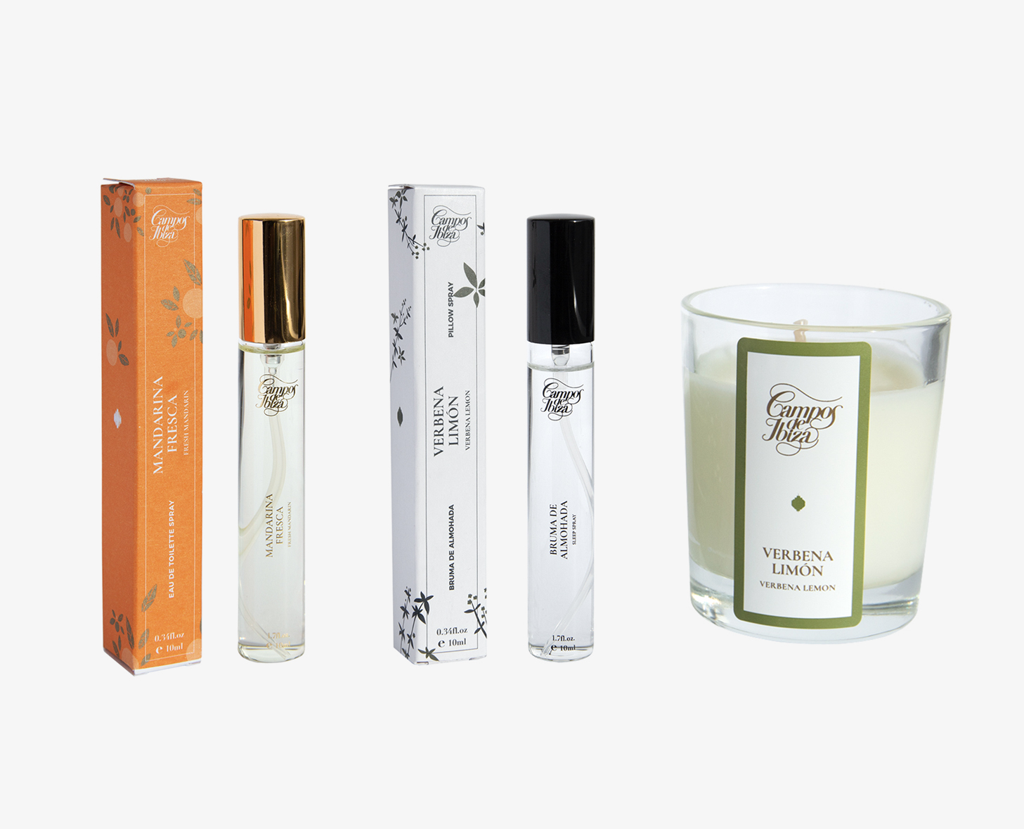 Una collezione di prodotti profumati che include flaconi di profumo da viaggio in confezioni arancioni e bianche e una candela in un contenitore di vetro con l'etichetta "Verbena Limon".