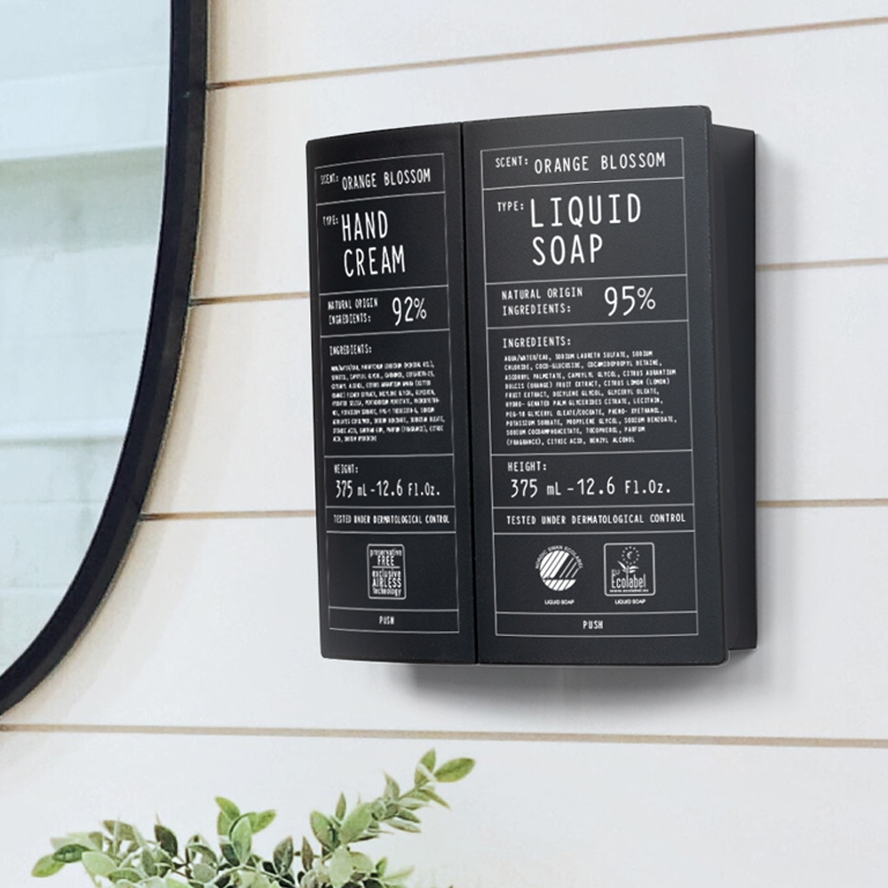 Een wanddispenser met handcrème en vloeibare zeep met sinaasappelbloesemgeur, waarop de ingrediënten en percentages duidelijk worden vermeld.