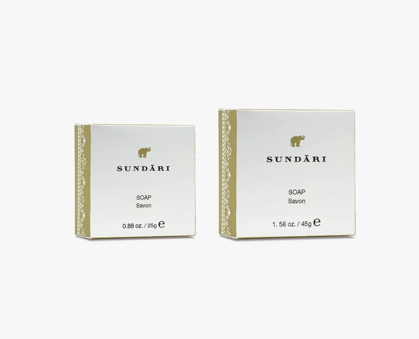 Duas caixas de sabonete Sundāri, uma com a indicação 0,86 oz e a outra com 1,58 oz, ambas com um design dourado e branco com um elefante estampado.