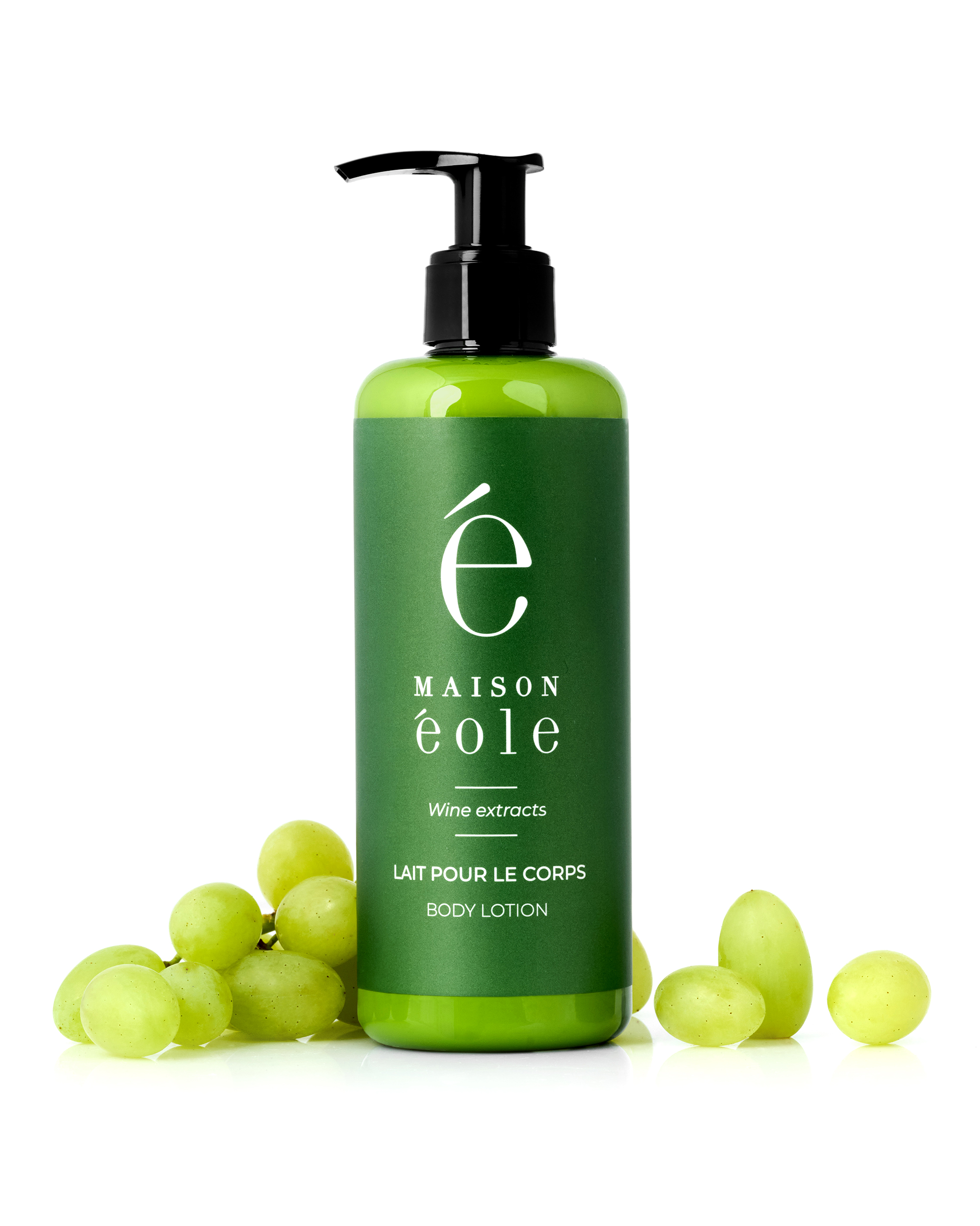 Maison Éole body lotion bottle displayed with fresh green grapes.