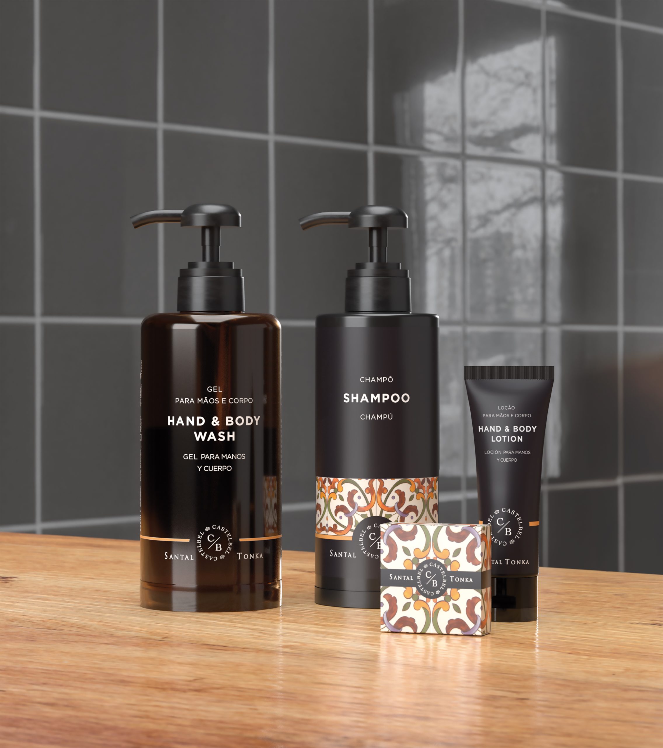 Santal Tonka hospitality amenities collection featuring hand & body wash, shampoo, body lotion, and soap displayed on a wooden countertop.