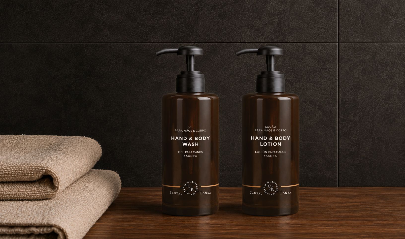Castelbel Santal Tonka hand wash and body lotion bottles on a wooden countertop with spa-inspired décor.