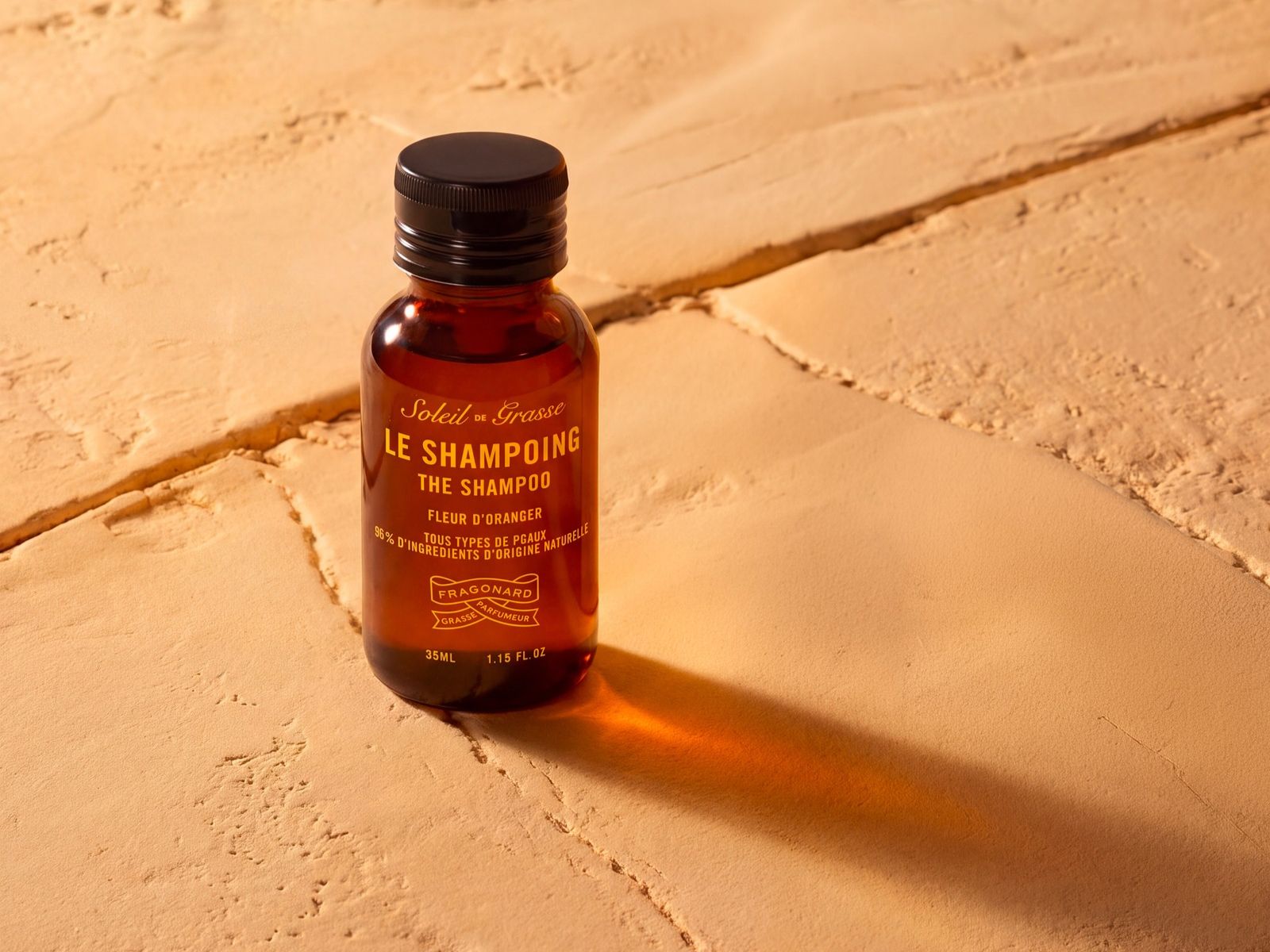 Fragonard Soleil de Grasse orange blossom shampoo travel-size bottle with naturally derived ingredients and floral fragrance.